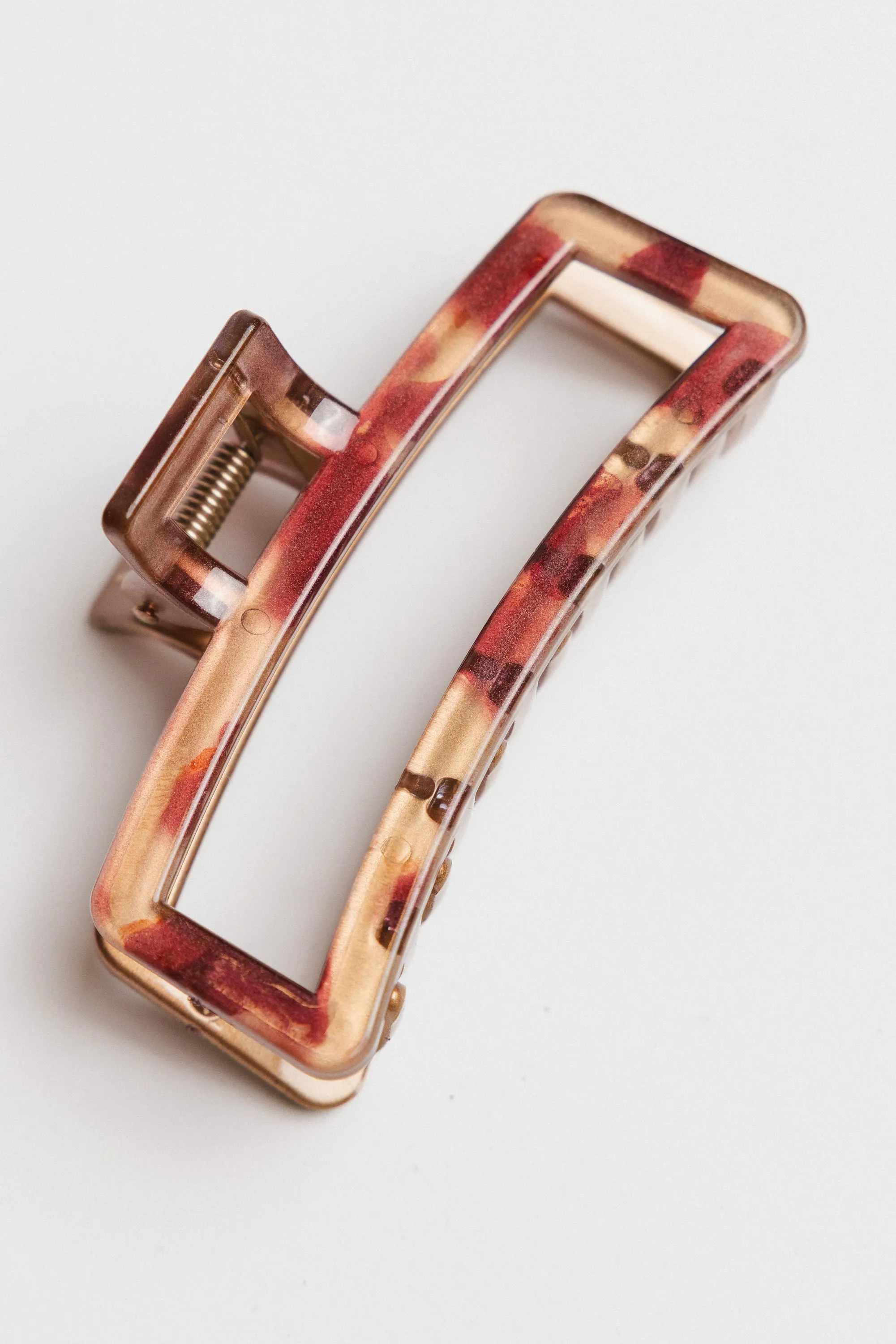 Abstract Cutout Claw Clip in Red sold by bohme