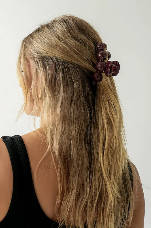 Pearl Claw Clip in Burgundy sold by bohme