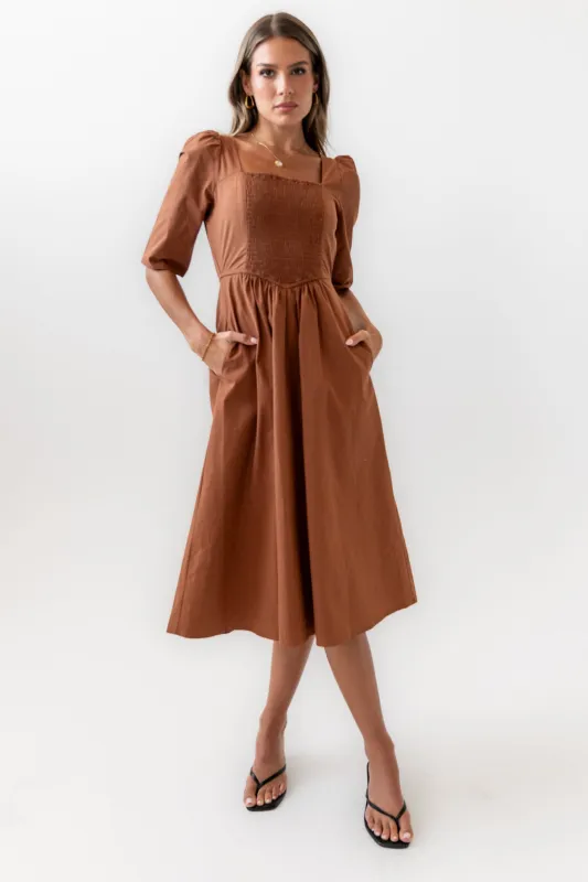 Paisley Smocked Midi Dress in Rust sold by bohme