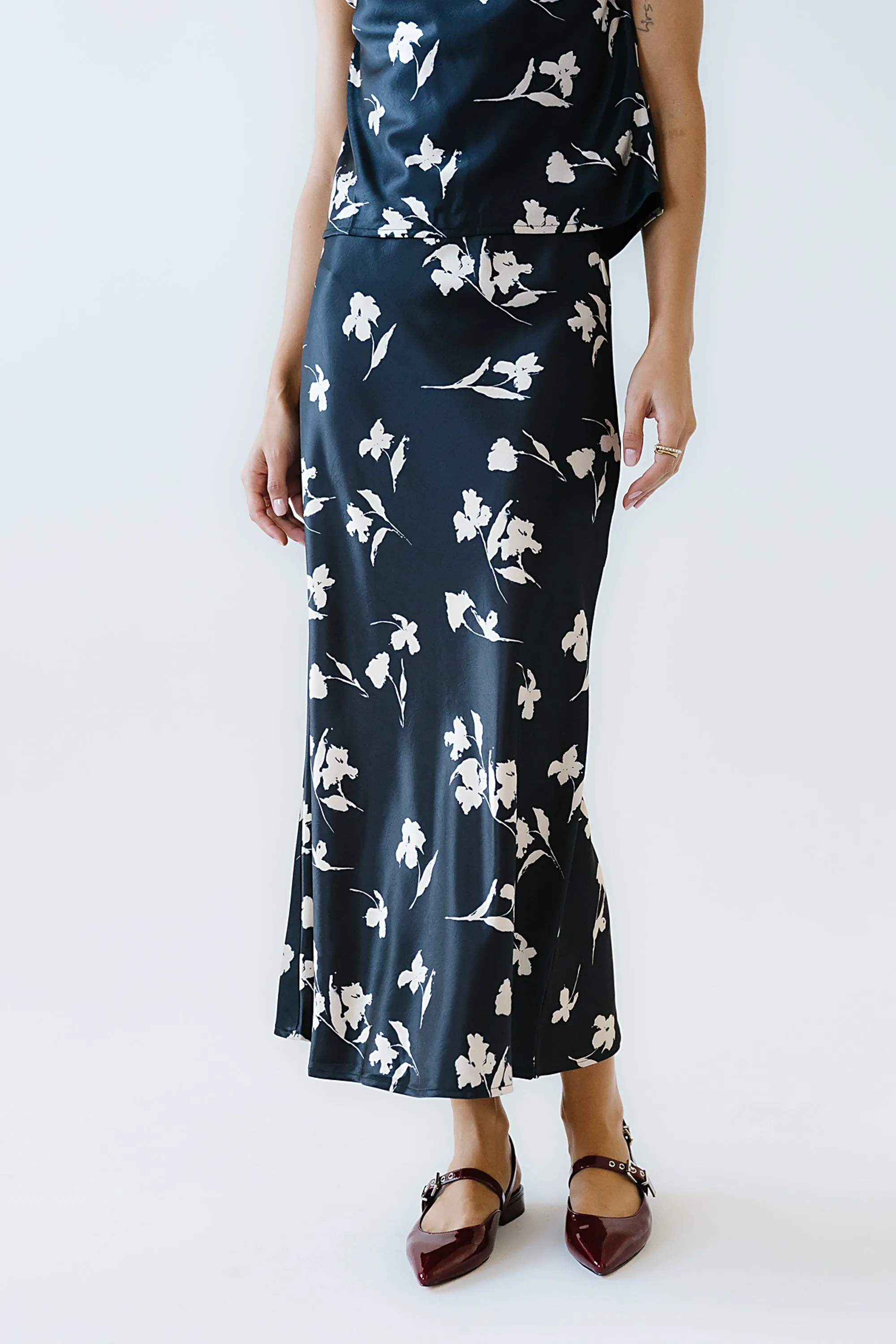 Carsyn Floral Maxi Skirt in Black sold by bohme