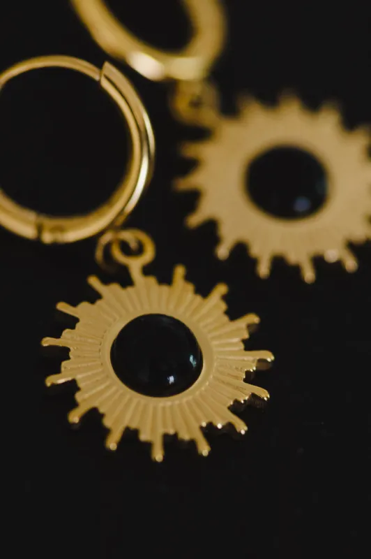 Eclipse Pendant Earrings sold by bohme