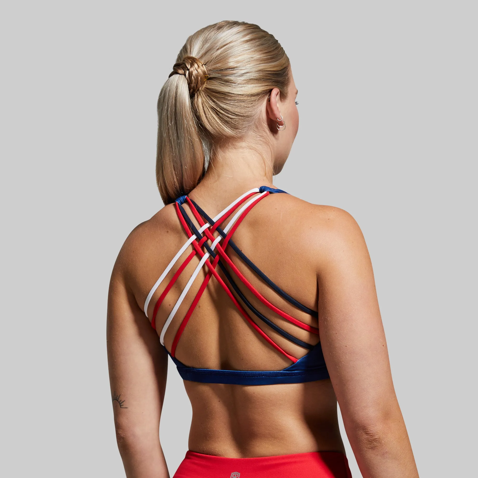Vitality Sports Bra (Brand Strength-Navy) sold by Born Primitive