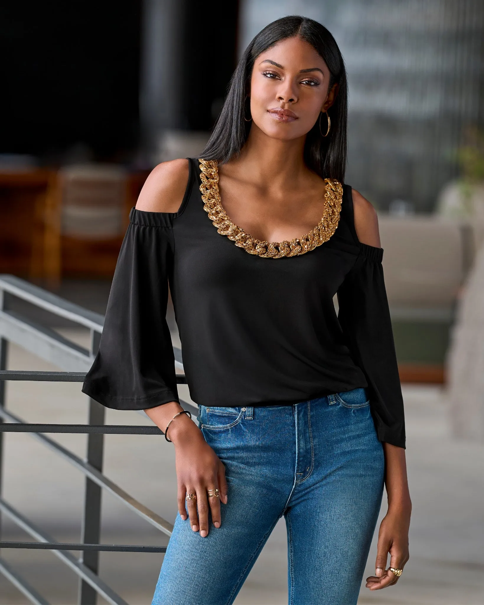 So Chic Cold Shoulder Heat Seal Chain Blouson Black sold by Boston Proper