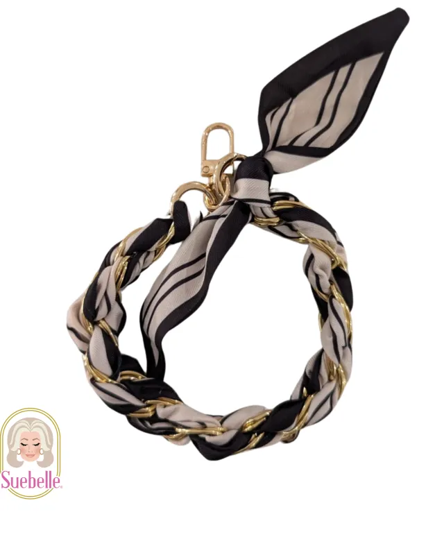 Black Tie Palms Phone Wristlet sold by Boston Proper
