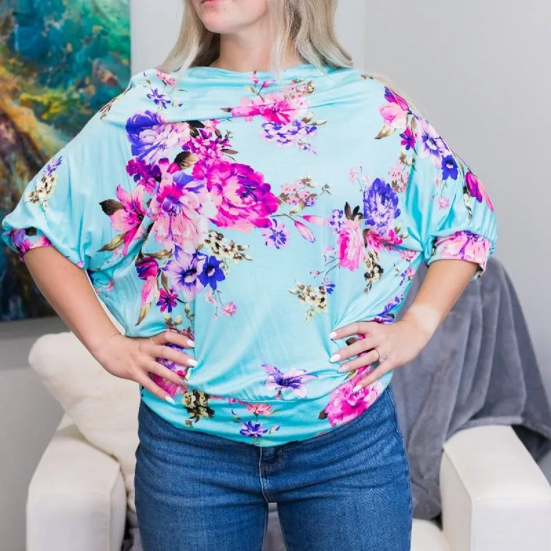 Aqua Floral Dolman Top sold by Boujee Boutique