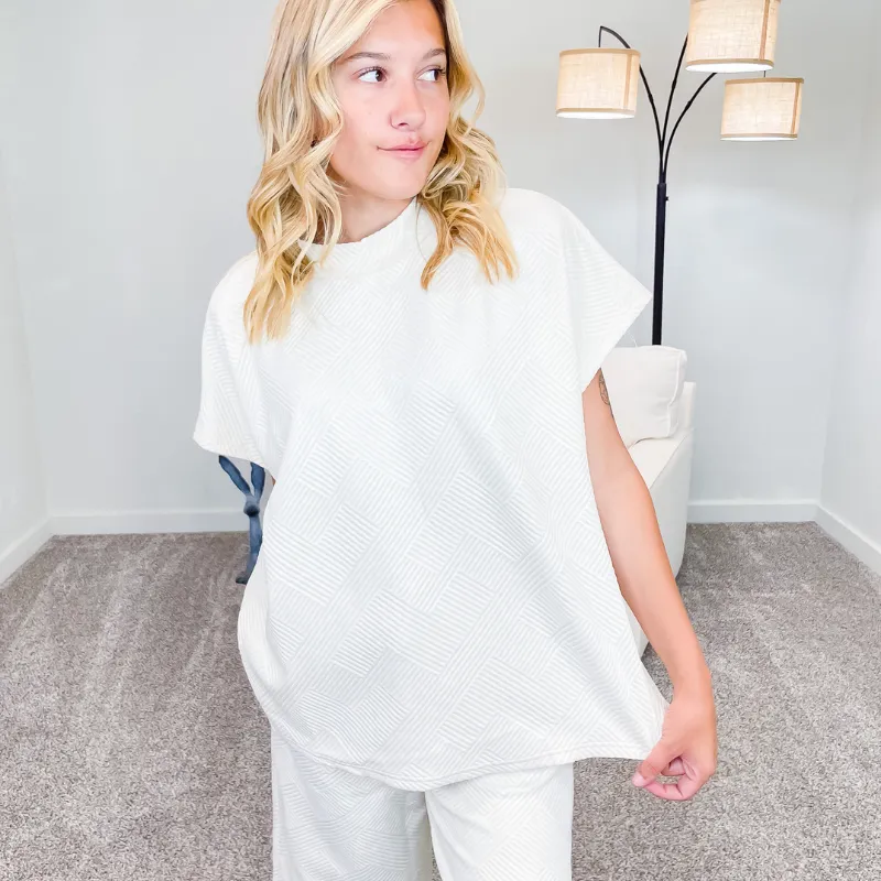 Cream Textured Short Sleeve Top sold by Boujee Boutique