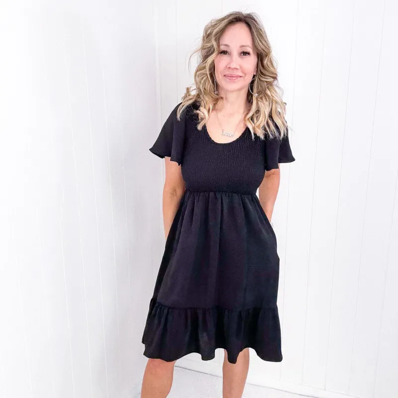 Midnight Black Smocked Fit and Flare Flutter Sleeve Dress sold by Boujee Boutique