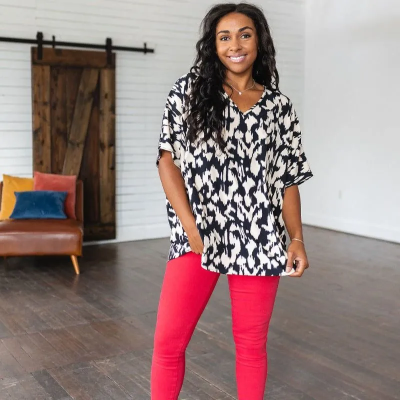 Unforgettable V-Neck Animal Print Blouse in Black sold by Boujee Boutique