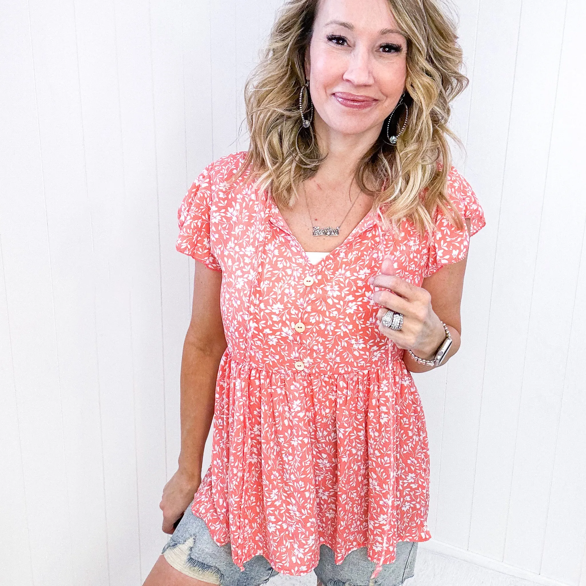 Flirty and Thriving Floral Flutter Sleeve Top in Peach sold by Boujee Boutique