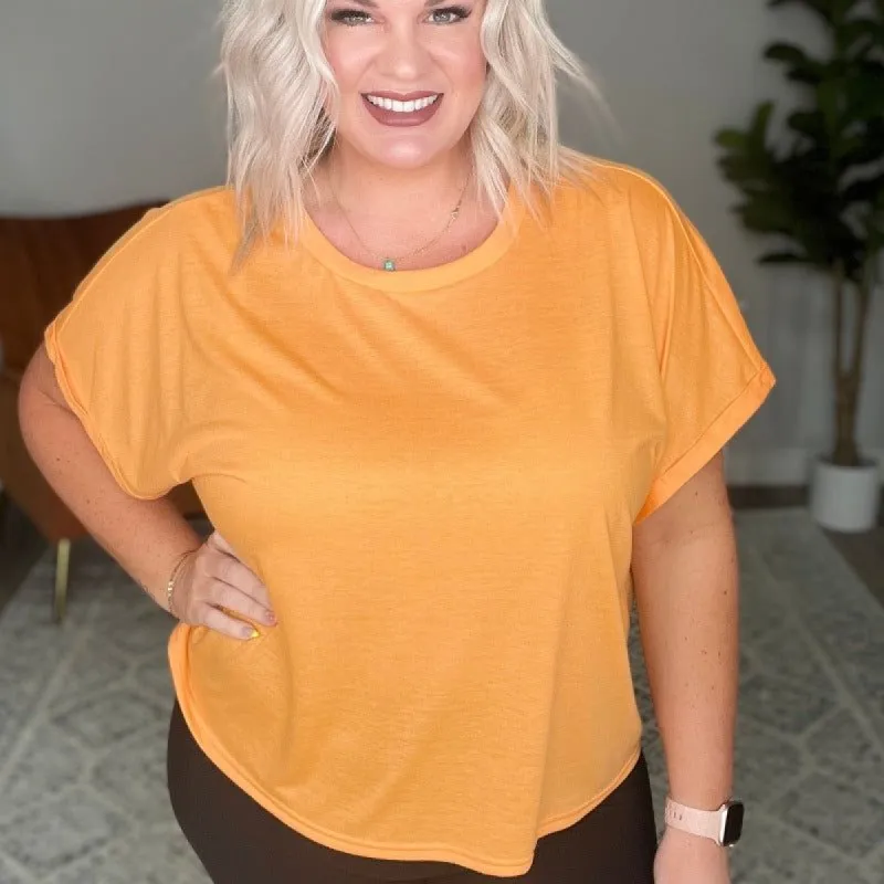 Round Neck Cuffed Short Sleeve Top in Neon Orange sold by Boujee Boutique