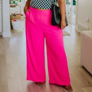 I Love These High Rise Wide Leg Pants in Hot Pink sold by Boujee Boutique