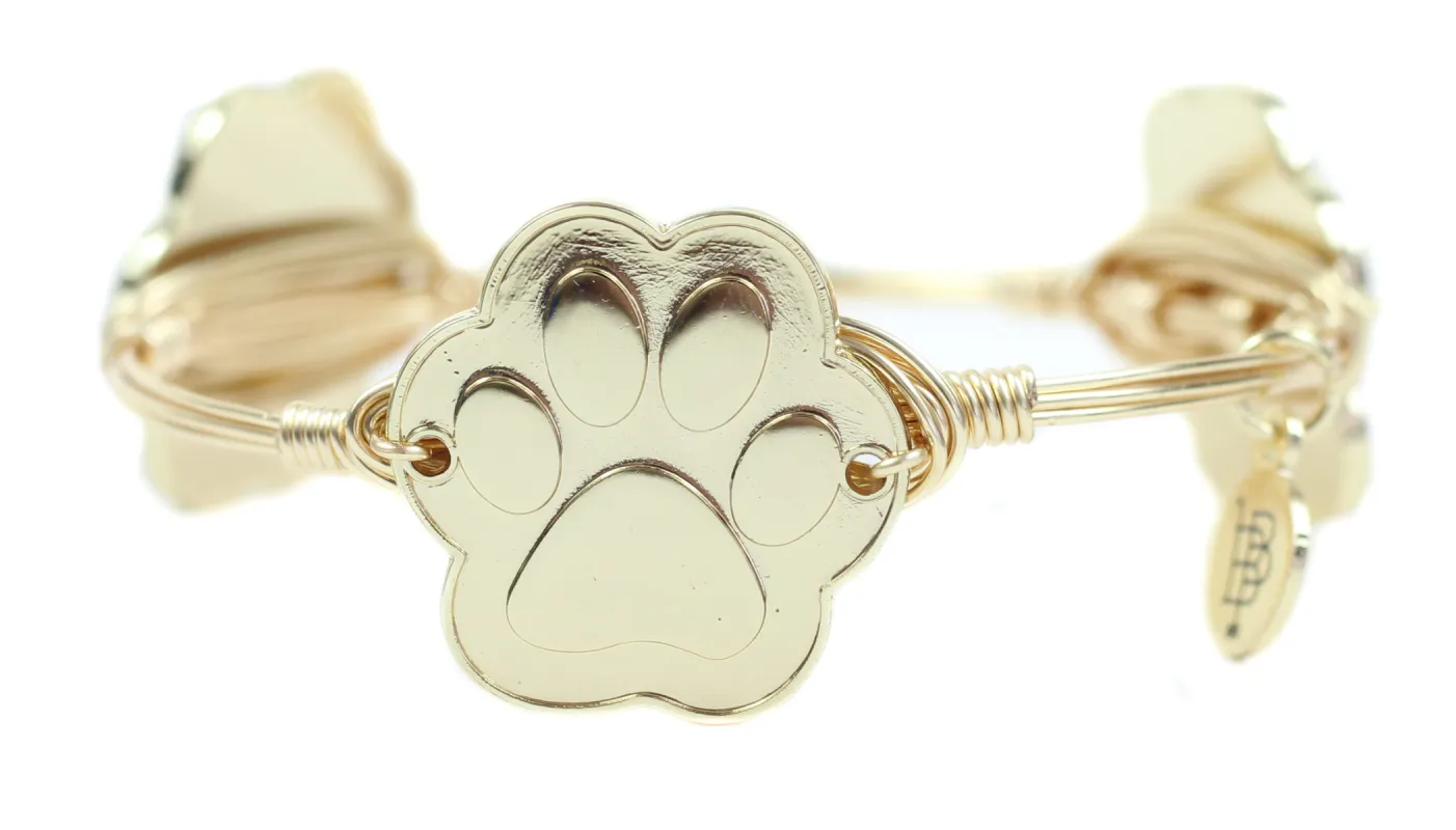 The Paw Print Bangle sold by Bourbon and Bowties