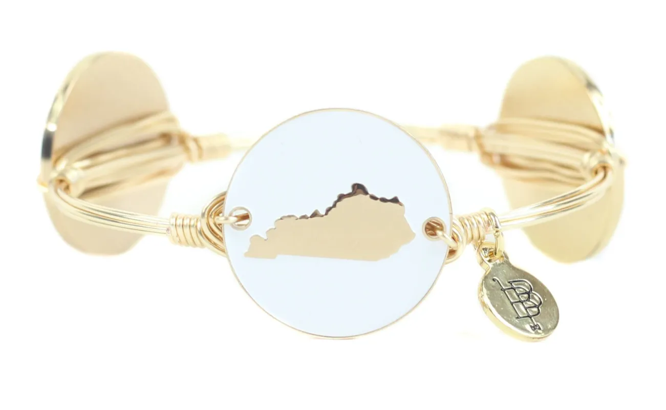The Gold + White Kentucky Bangle Bracelet sold by Bourbon and Bowties