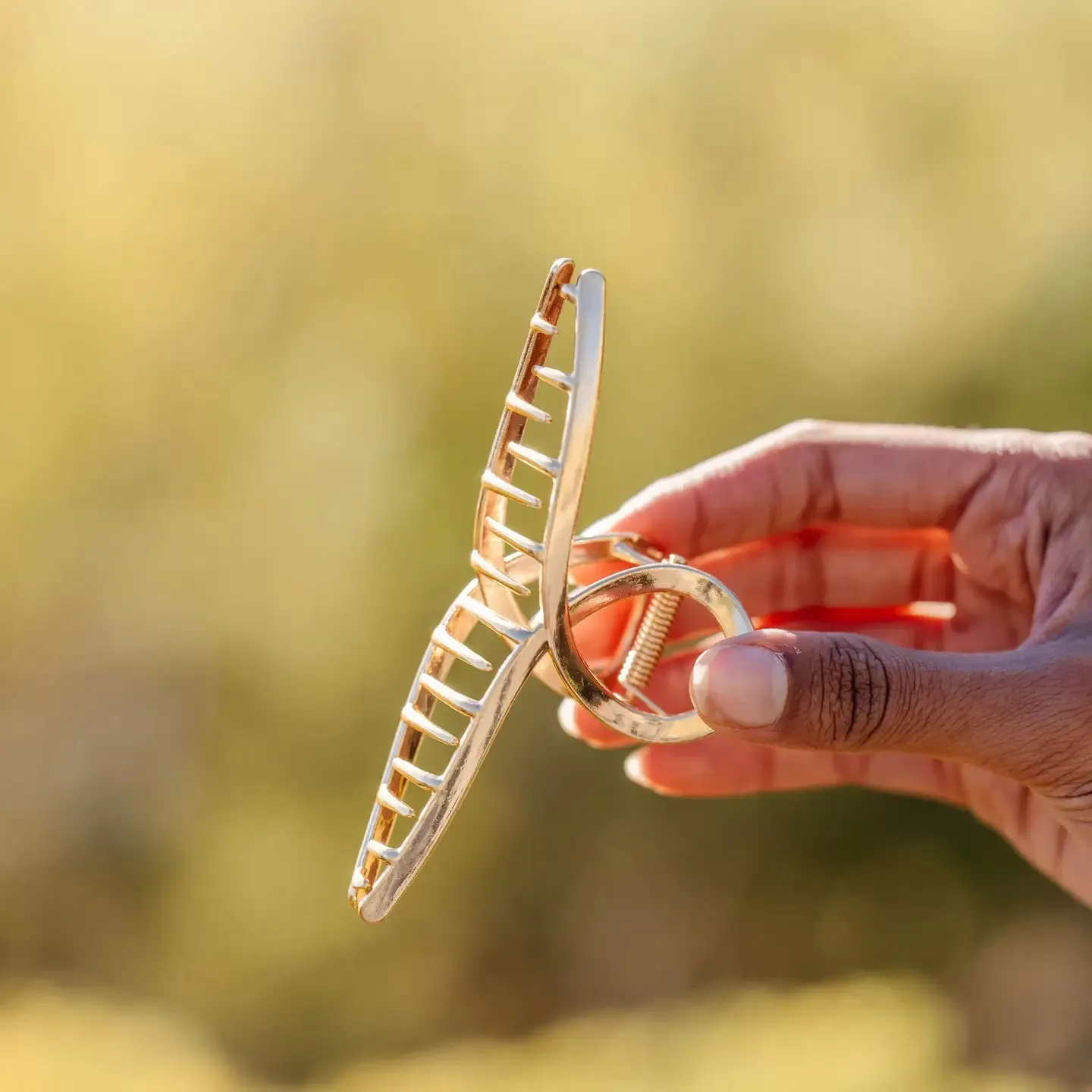 ANDi Gold Swirl Claw Clip sold by Boutique with Grace