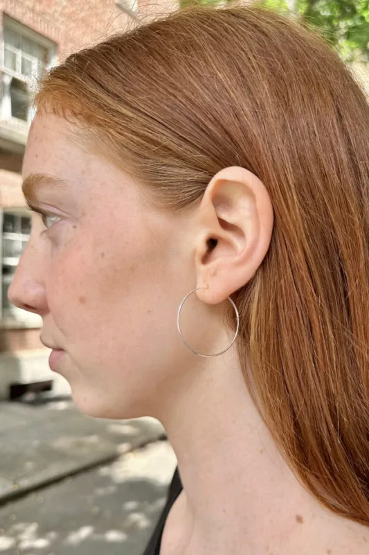 Sterling Silver Thin Hoop Earrings sold by Brandy Melville