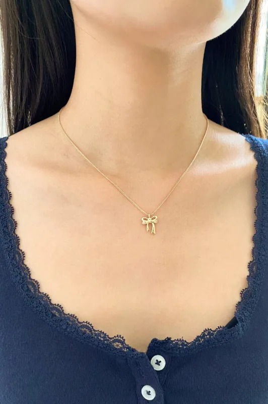 Bow Necklace sold by Brandy Melville