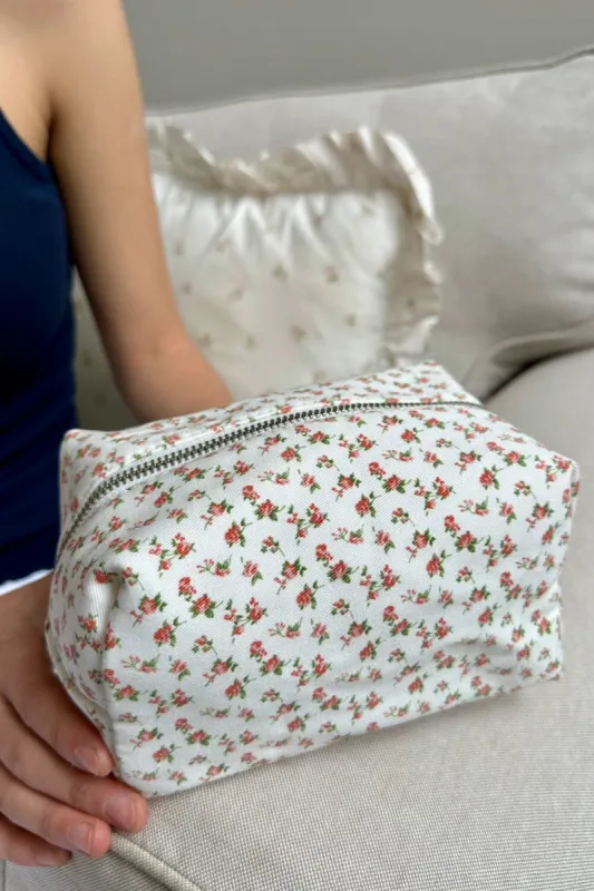 Roses Mini Makeup Bag sold by Brandy Melville