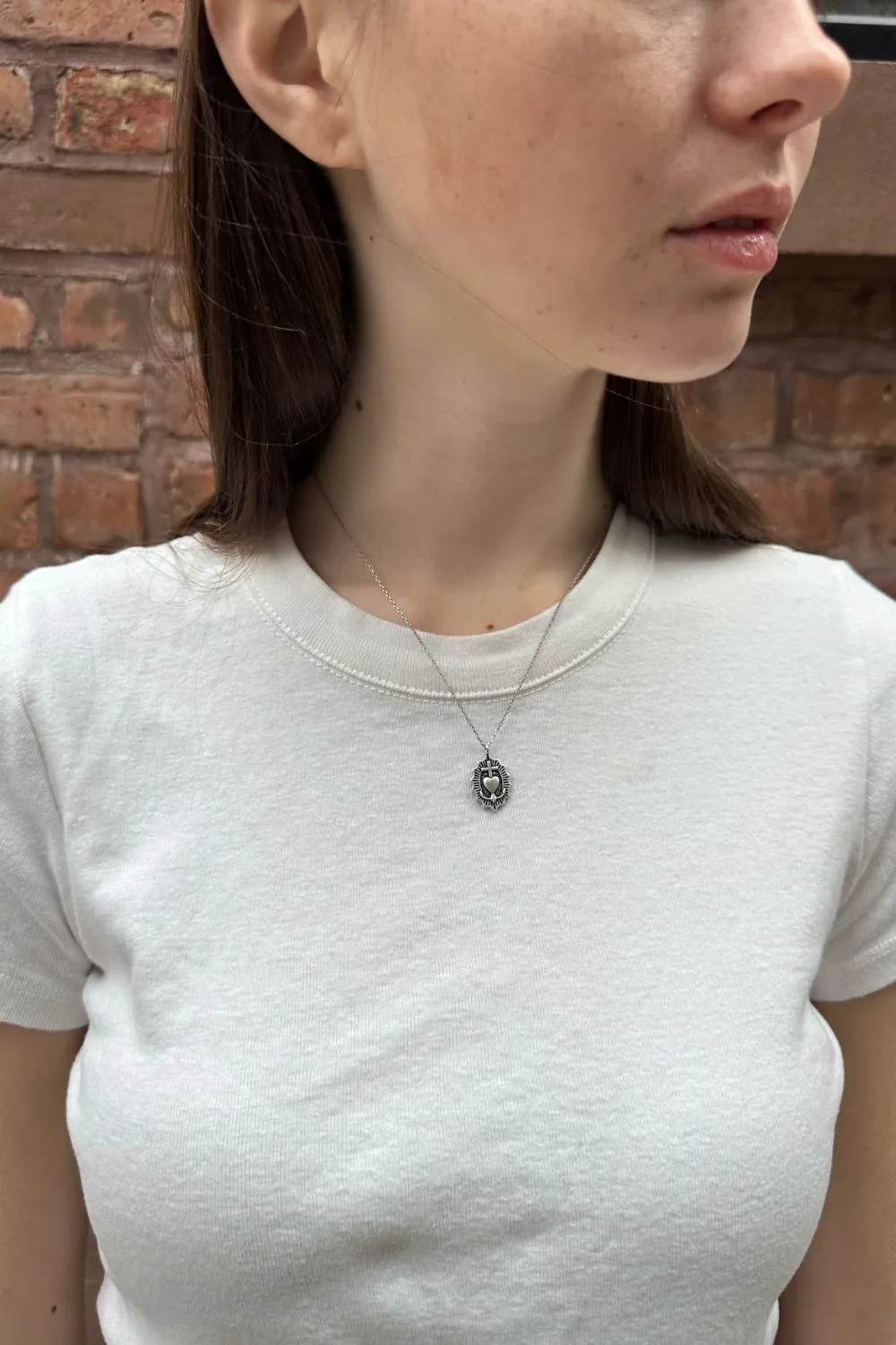 Heart with a Cross Necklace sold by Brandy Melville