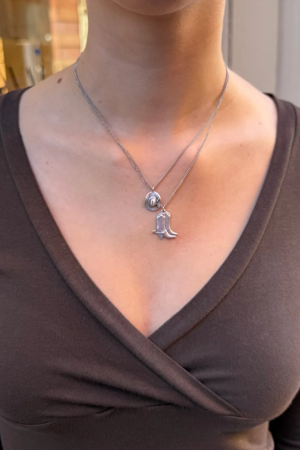 Santa Cowboy Hat & Boots Necklace sold by Brandy Melville