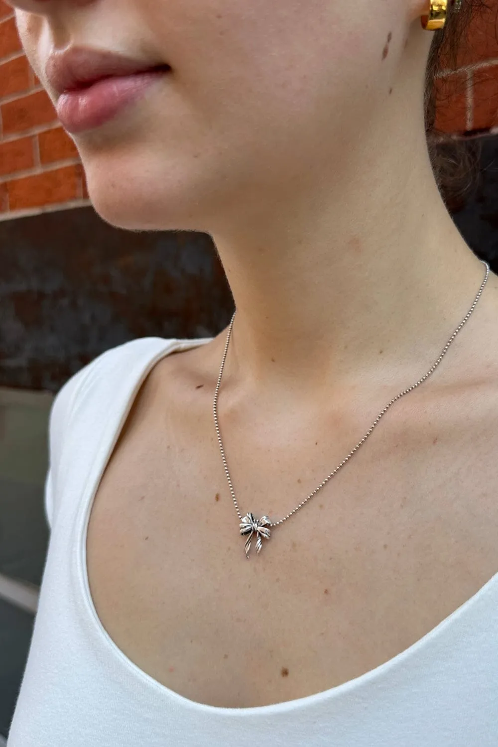 Bow Necklace sold by Brandy Melville product image thumbnail 2