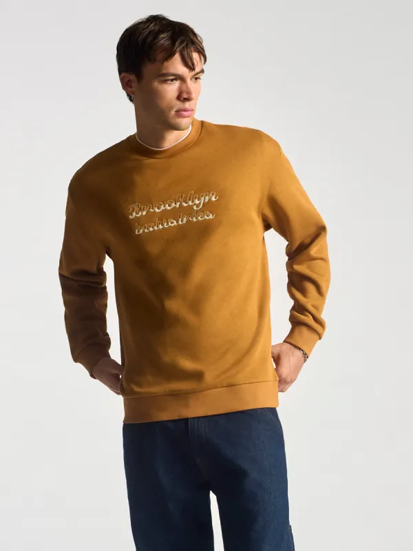 Men's Embroidered Crew Neck Sweatshirt In Spice made by Brooklyn Industries