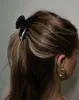 The Marble Claw Clip | Black sold by Brunette The Label