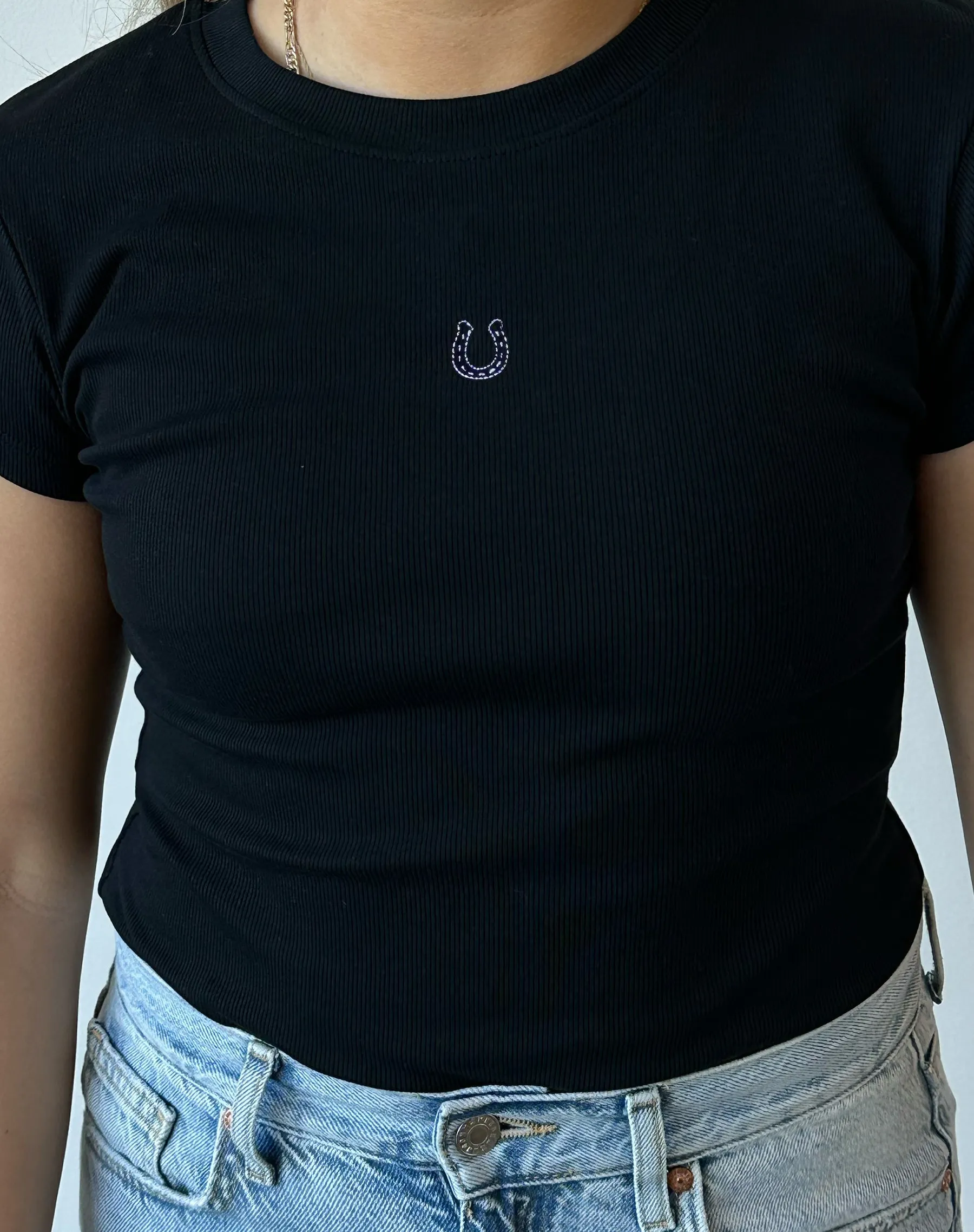 The Embroidered Horseshoe Ribbed Tee | Black sold by Brunette The Label