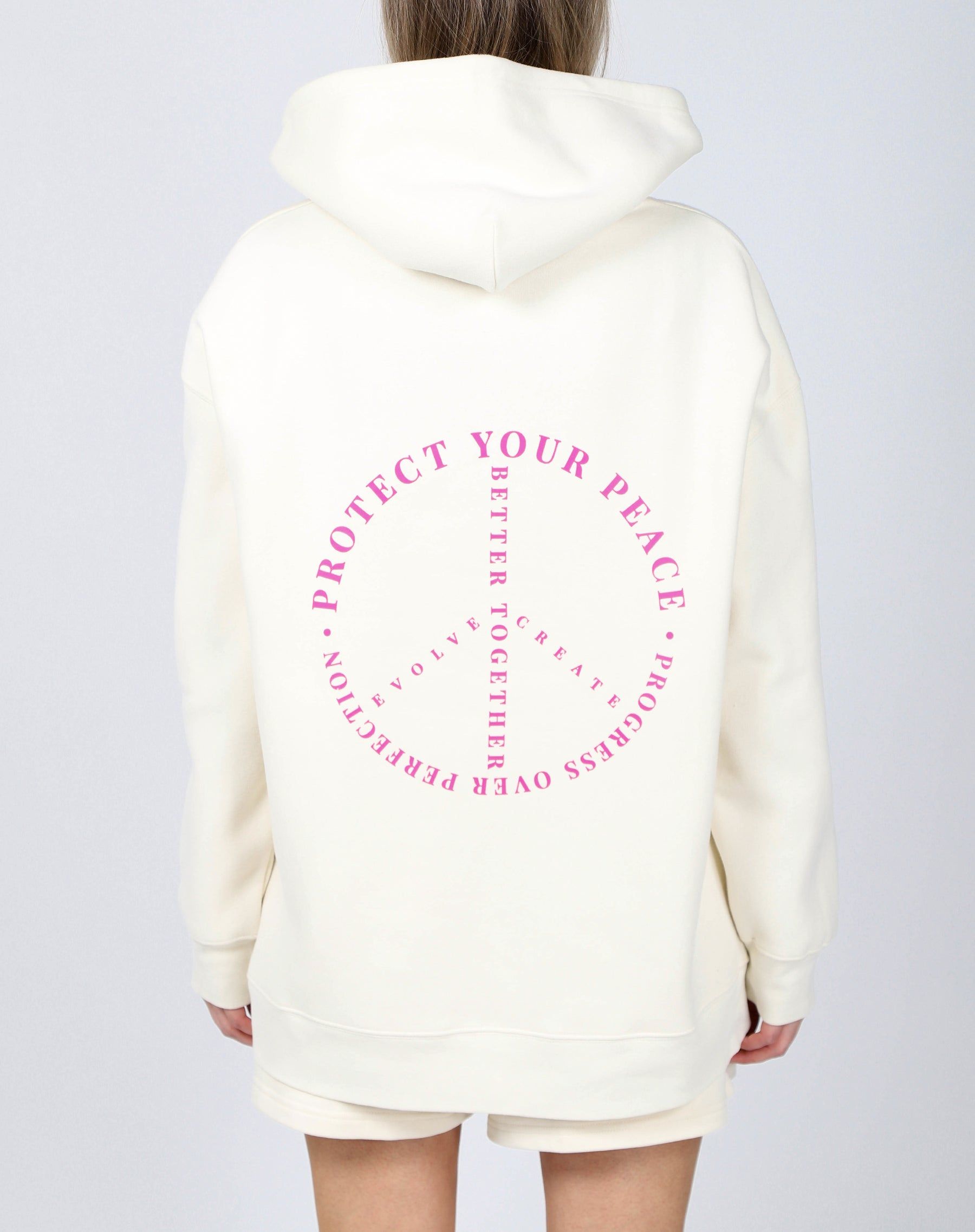 The "PROTECT YOUR PEACE" Big Sister Hoodie | Almond Milk & Fuchsia sold by Brunette The Label