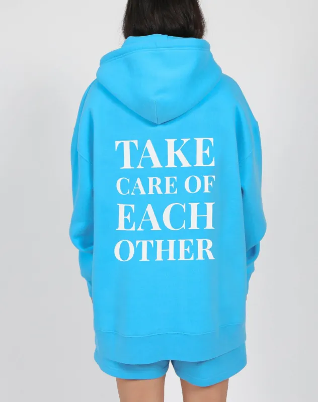 The "TAKE CARE OF EACH OTHER" Big Sister Hoodie | Mediterranean Blue sold by Brunette The Label