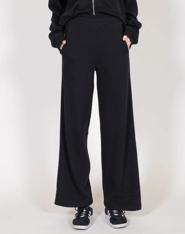 Waffle Wide Leg Pant | Black sold by Brunette The Label