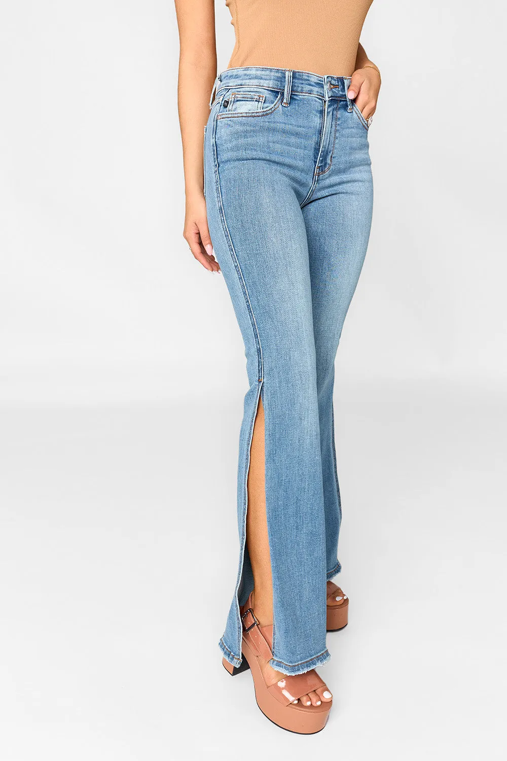 Judy Blue Full Size Mid Rise Raw Hem Slit Flare Jeans sold by Buddy Love