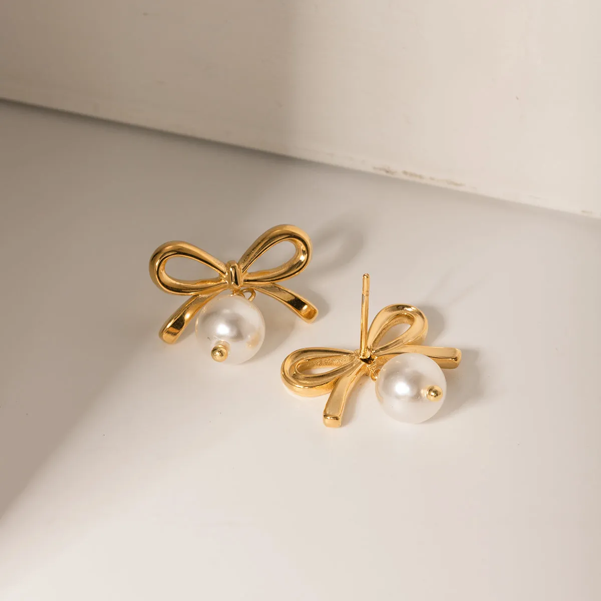 Stainless Steel Bow Pearl Earrings sold by Buddy Love product image thumbnail 2
