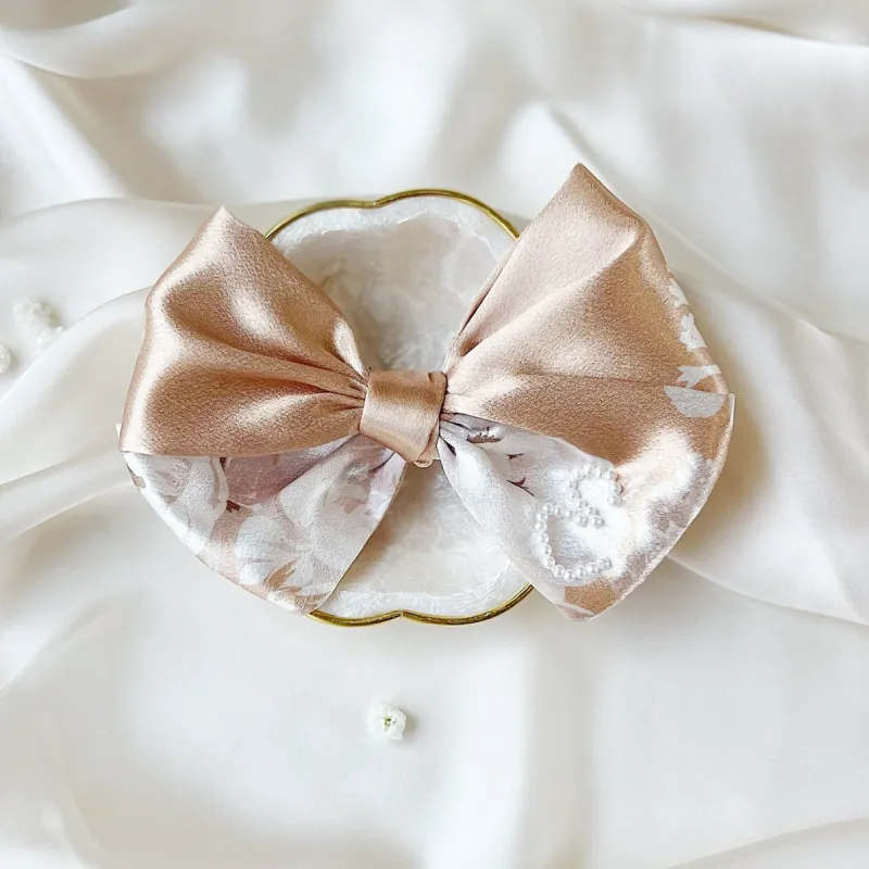 Cream Rose Pearl Medium Bow sold by Buddy Love