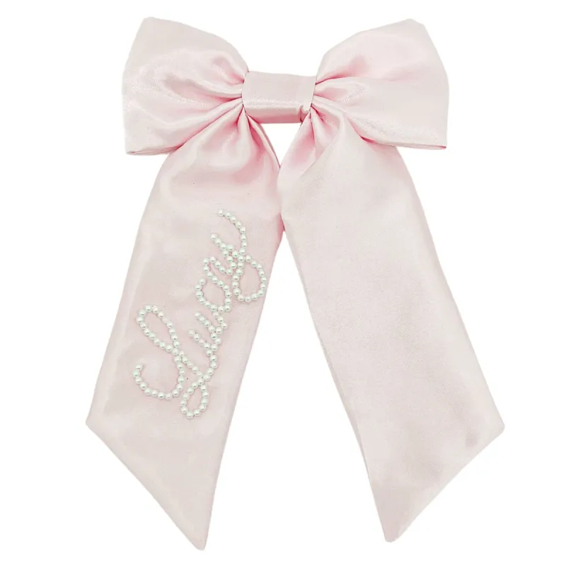 Pink Pearl Bow sold by Buddy Love