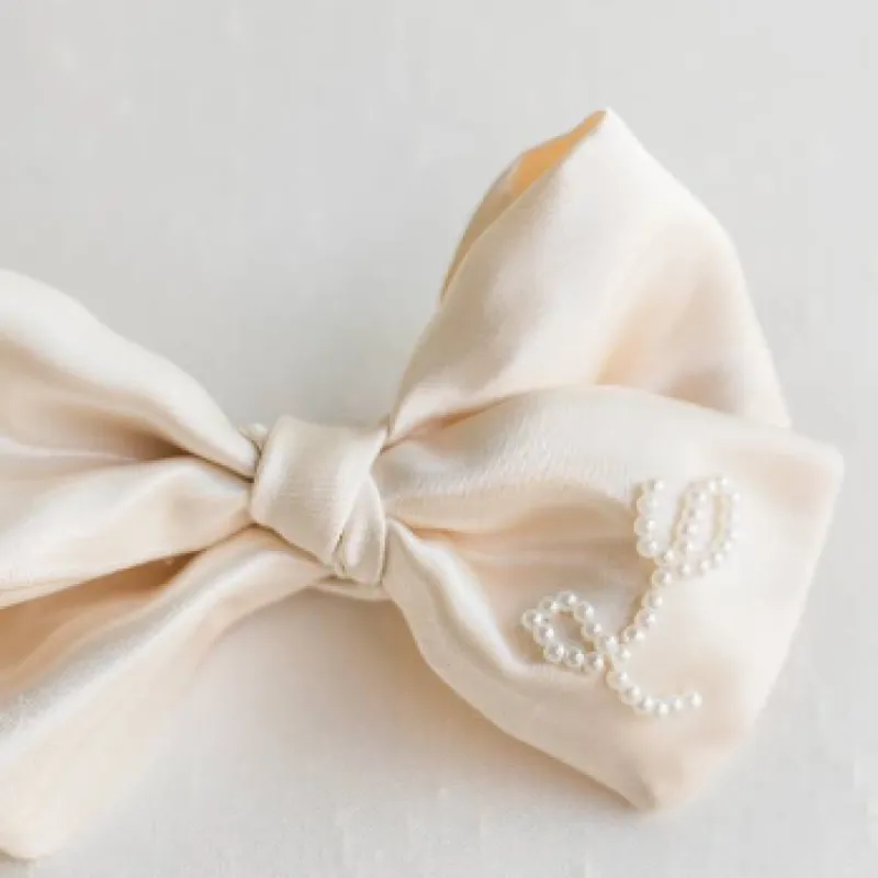 Ivory Satin Oversized Bow with Pearl Initial sold by Buddy Love
