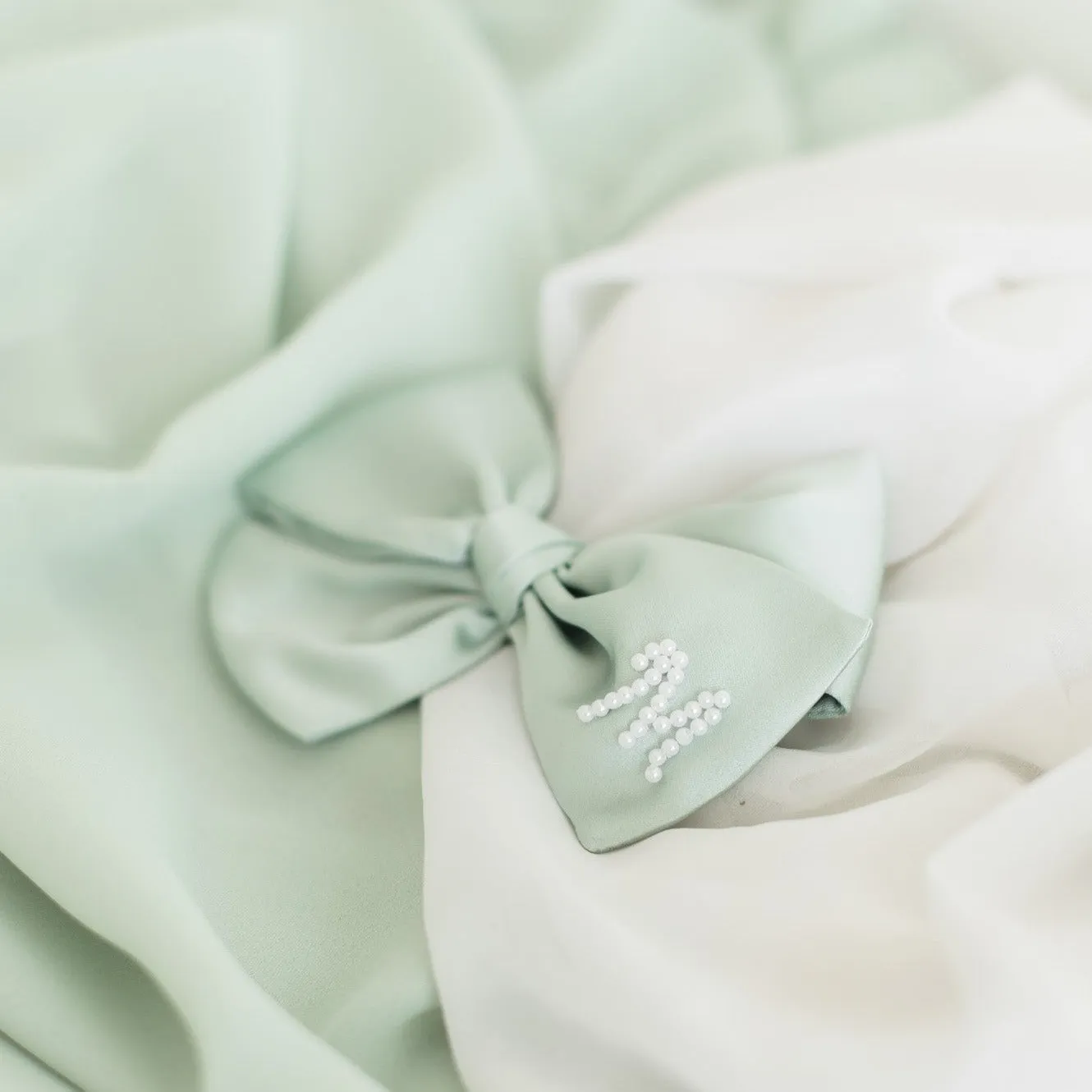 Pastel Green Pearl Initial Bow sold by Buddy Love product image thumbnail 2