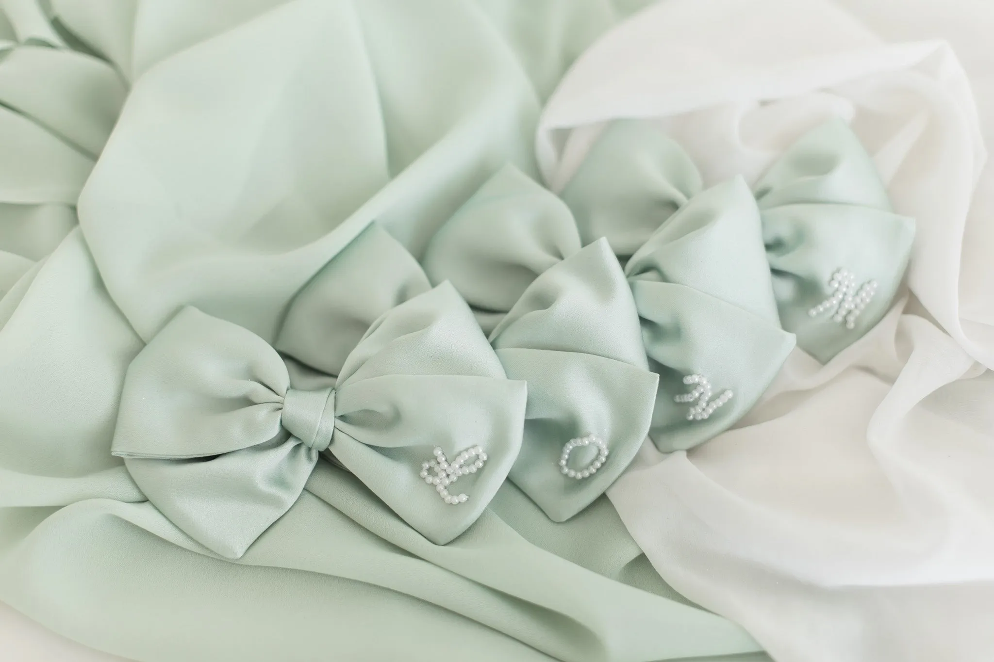 Pastel Green Pearl Initial Bow sold by Buddy Love product image thumbnail 3