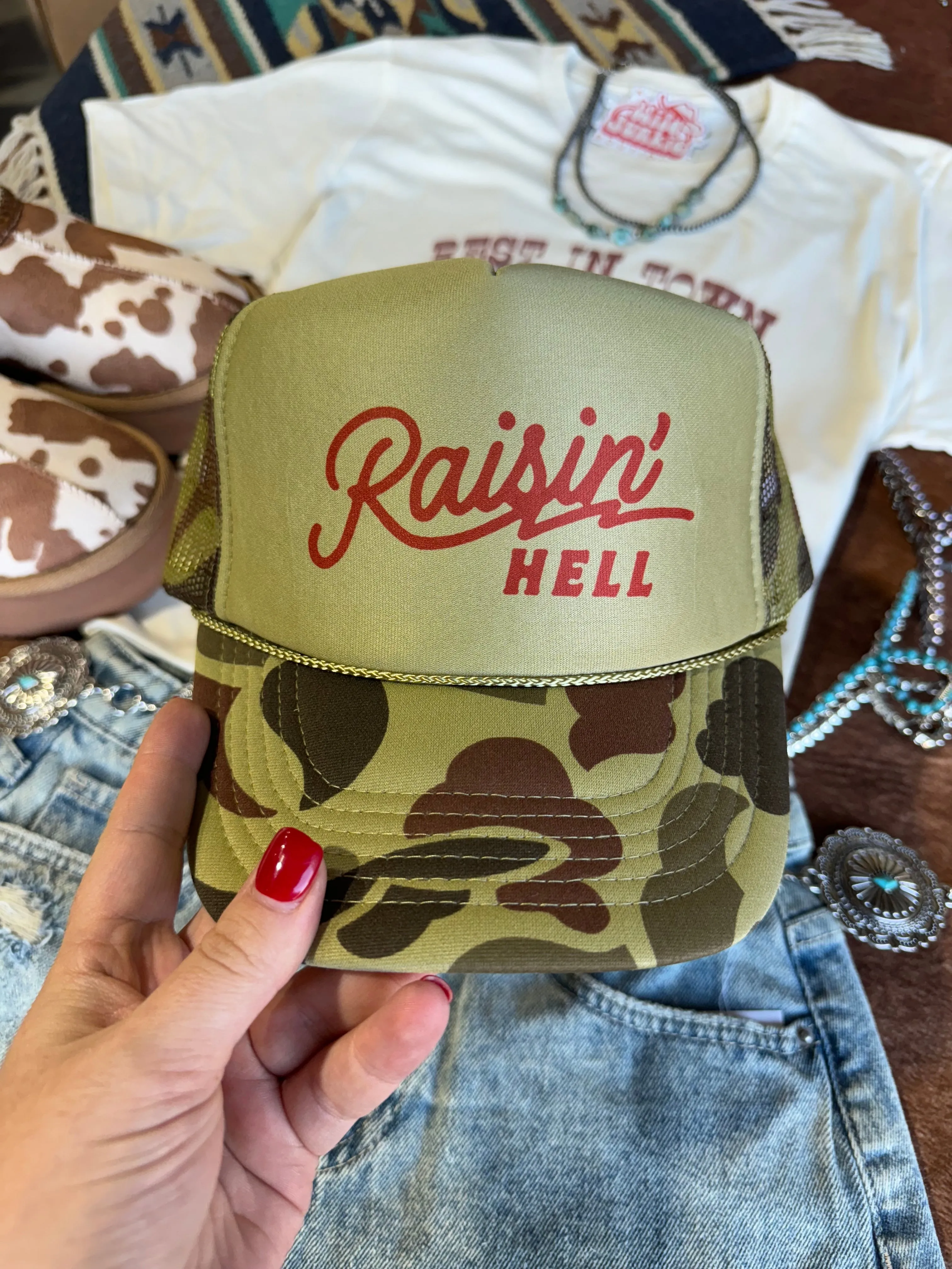 Raisin' Hell Green Camo Trucker Hat sold by Buddy Love product image thumbnail 2