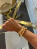 TRIPLE GOLD EMMA BRACELET sold by Buddy Love