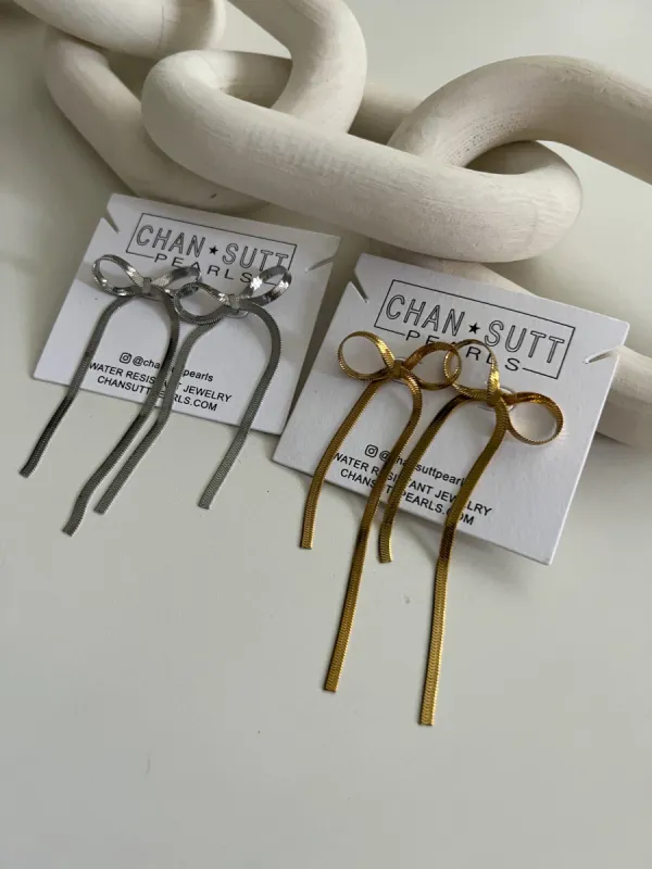 LARGE BOW EARRINGS sold by Buddy Love