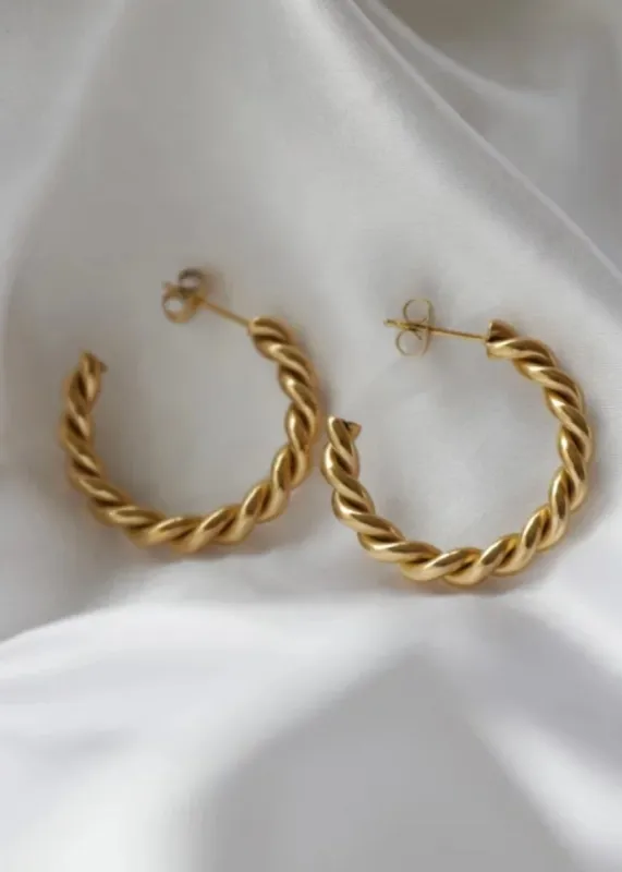 GOLD MEDIUM TWIST HOOPS sold by Buddy Love
