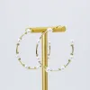 Pearl Girl Hoop Earrings sold by Buddy Love
