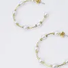 Pearl Girl Hoop Earrings sold by Buddy Love