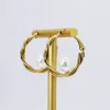 Pearl Embrace Hoop Earrings sold by Buddy Love