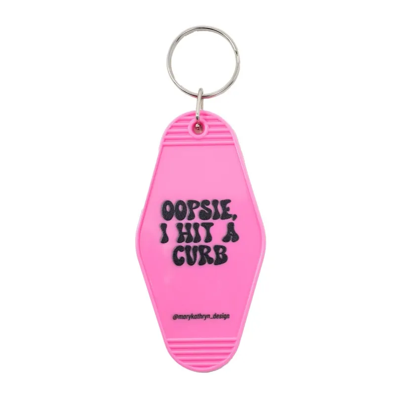 PREORDER Oopsie, I Hit A Curb Keychain (Pink) sold by Buddy Love