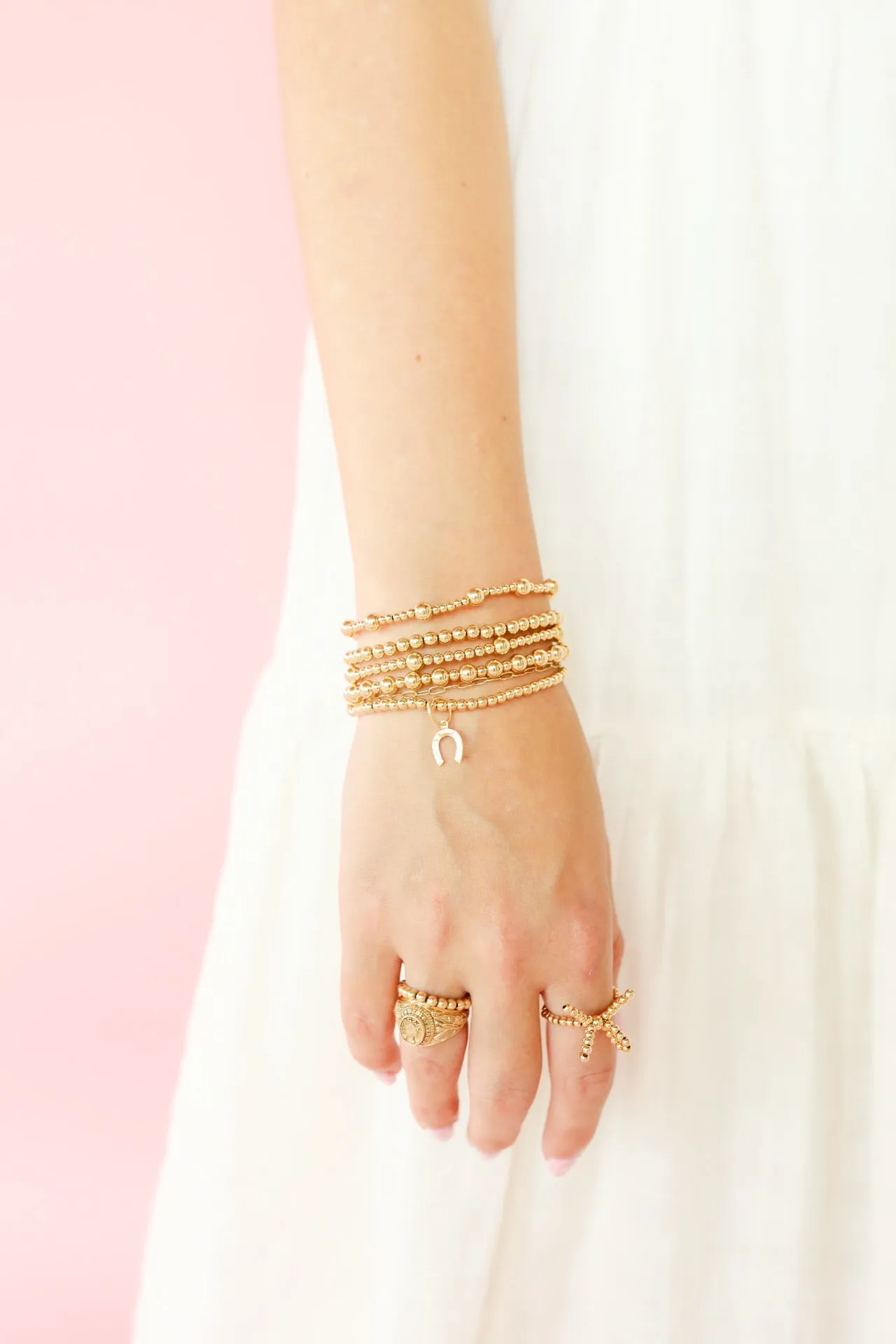 Horseshoe Gold Charm Bracelet sold by Buddy Love