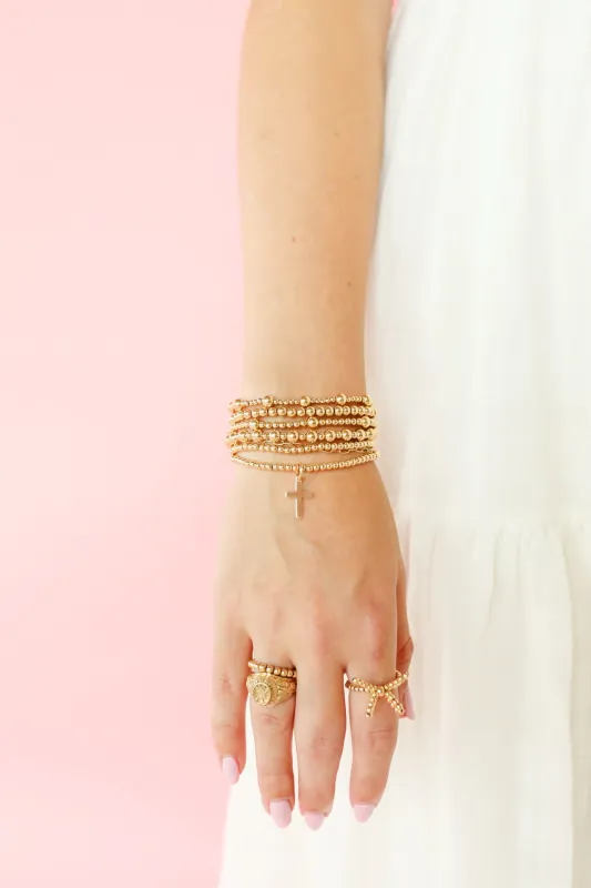 Cross Gold Charm Bracelet sold by Buddy Love