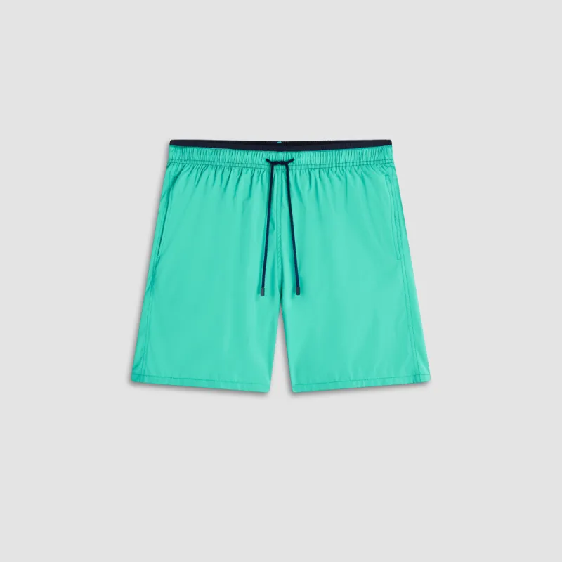 Quinn Solid Swim Trunks sold by Bugatchi