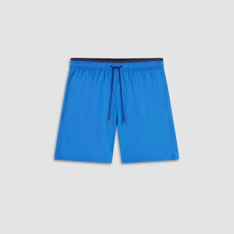 Quinn Solid Swim Trunks sold by Bugatchi