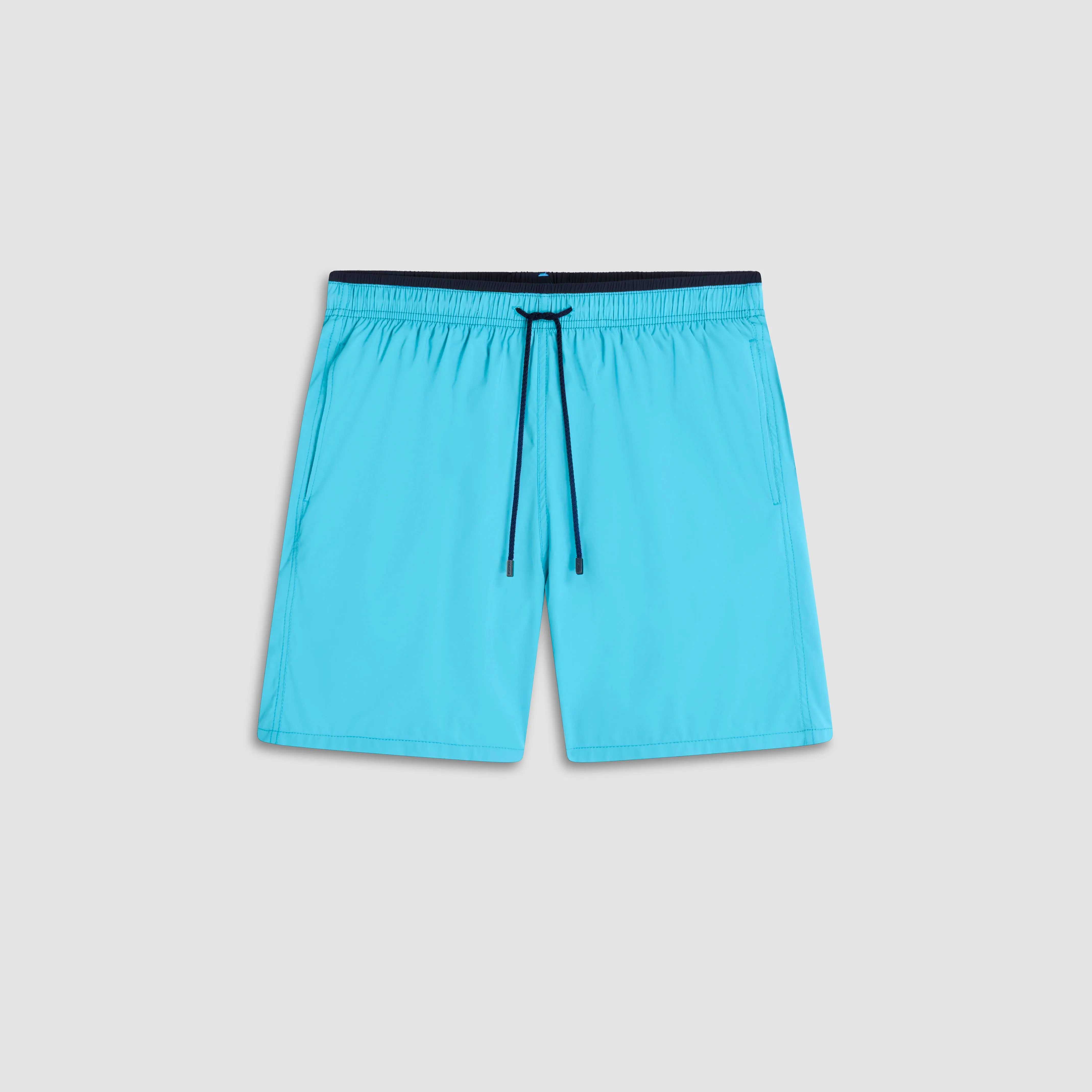 Quinn Solid Swim Trunks sold by Bugatchi